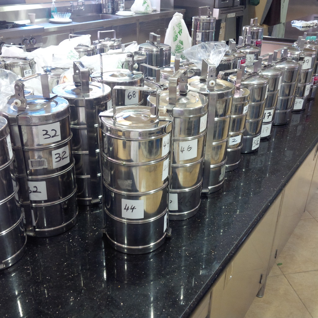 "thaali" containers, one for each family , prepared daily